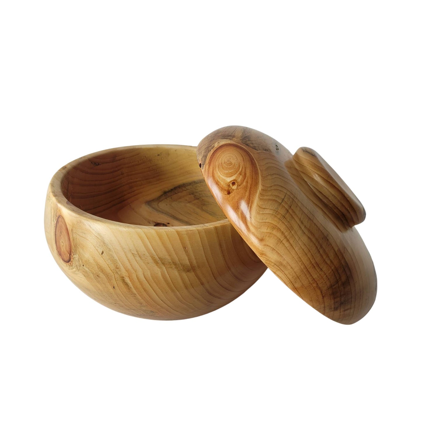 I enjoy turning Eastern White Pine! It has marvelous patterns, smells amazing and ages to a beautiful tan. The beauty of the White Pine natural wood makes the White Pine Bowl a stunning centerpiece, or a cookie jar. Due to the nature of the material, no two bowls are alike, and cracks may appear over time in the wood. Avoid exposure to water.